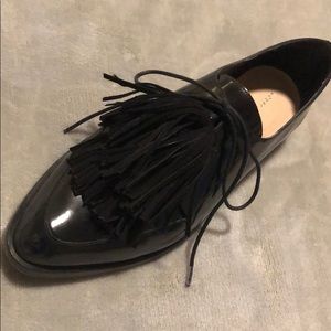 Loeffler Randal tie-up kiltie shoes.